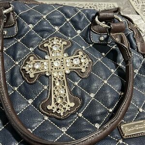 Blue purse with cross and matching wallet with cross gently used